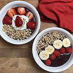 2 Berried Green Smoothie Bowls topped with bananas and granola