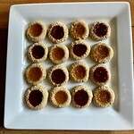gluten-free thumbprint cookies on a square platter