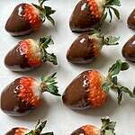 vegan chocolate-covered strawberries on parchment paper