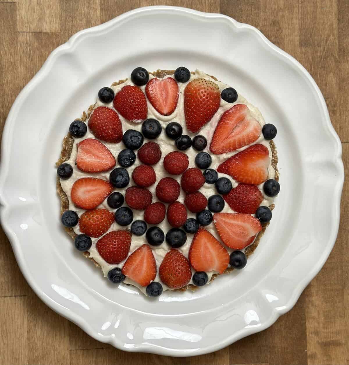 Vegan gluten-free No-Bake Fruit Tart with strawberries, blueberries, and raspberries